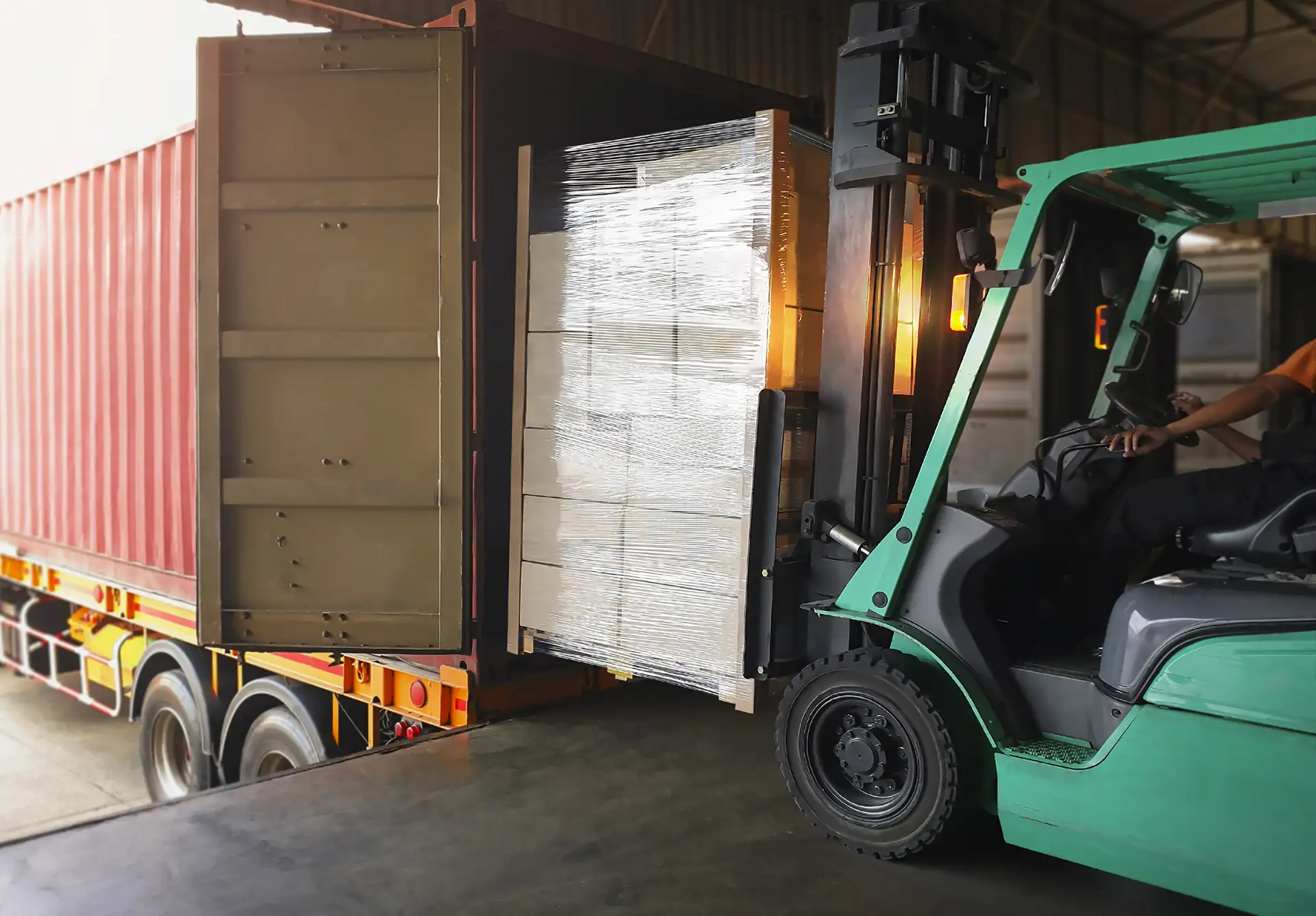 Loading goods onto a truck with a forklift – CGM Trasporti